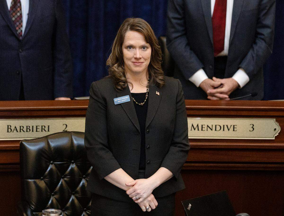 Rep. Priscilla Giddings, R-White Bird, stands for the opening prayer at the House session on March 16, 2022.