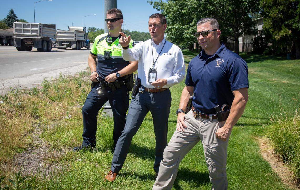 Subasic Damir, left, Chief Pat Calley and Sgt. Ryan Wilkie, with City of Eagle Police, watch traffic flow through Ñ with a few near misses Ñ at the Eagle Road and Highway 44 intersection on the left-turn blinking yellow arrow. “It’s a well-designed intersection,” said Damir. “But any significant crash at this intersection usually is related to that.”