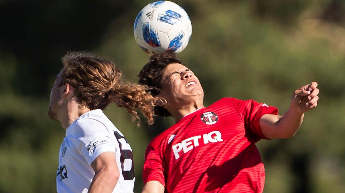Damian Arguello, right, competes with Cameron McDermott for a header in the U-19/20 Idaho State Cup finals Monday at the Simplot Sports Complex in East Boise.