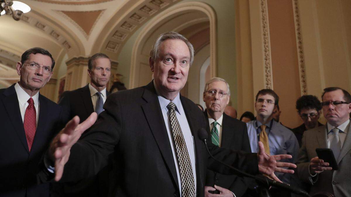 U.S. Sen. Mike Crapo, R-Idaho, chairman of the Senate Banking Committee, is shown here talking to reporters in 2018.
