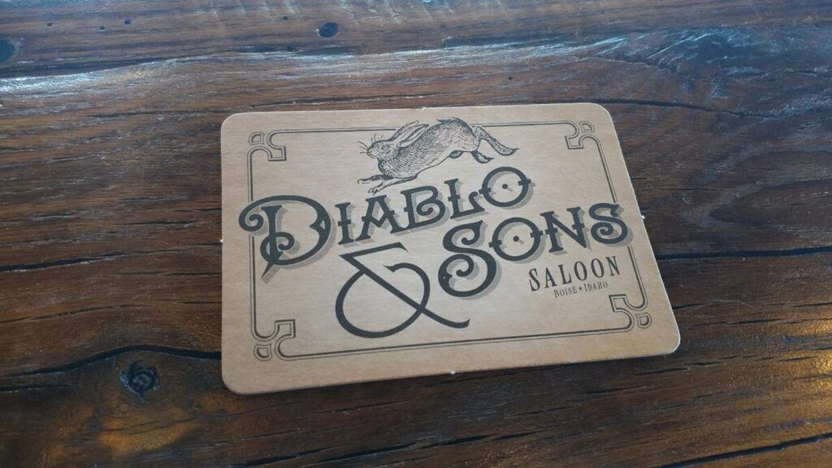 A beer coaster on the bar at Diablo & Sons.