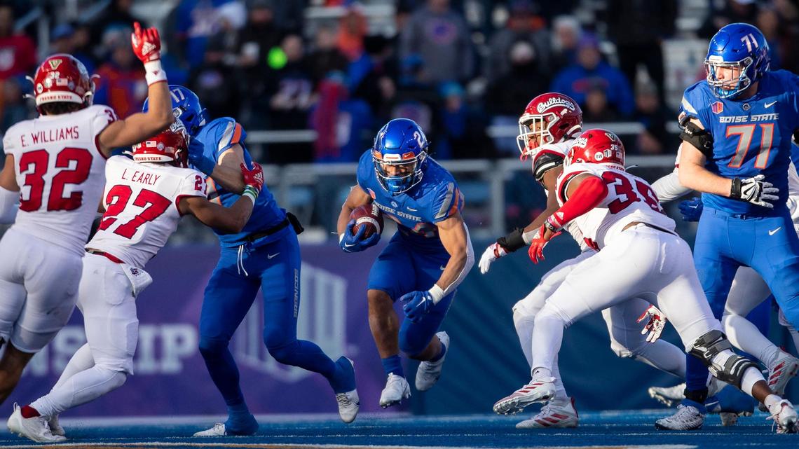 Boise State running back George Holani runs through a gap created by the Bronco offensive line in during the first half of the Mountain West Championship, Saturday, Dec. 3, 2022, at Albertsons Stadium in Boise.