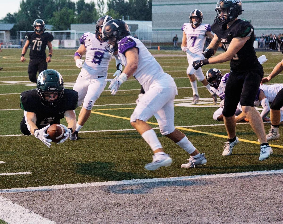 Eagle’s Deegan Martinho dives into the end zone against Rocky Mountain last season.
