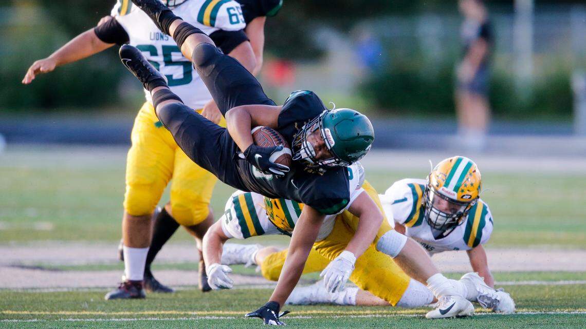 Eagle’s Jackson Stampfli goes airborne for a few extra yards after being hit by Borah’s Cameron Pruitt on Friday at Eagle High. Eagle won 29-14.