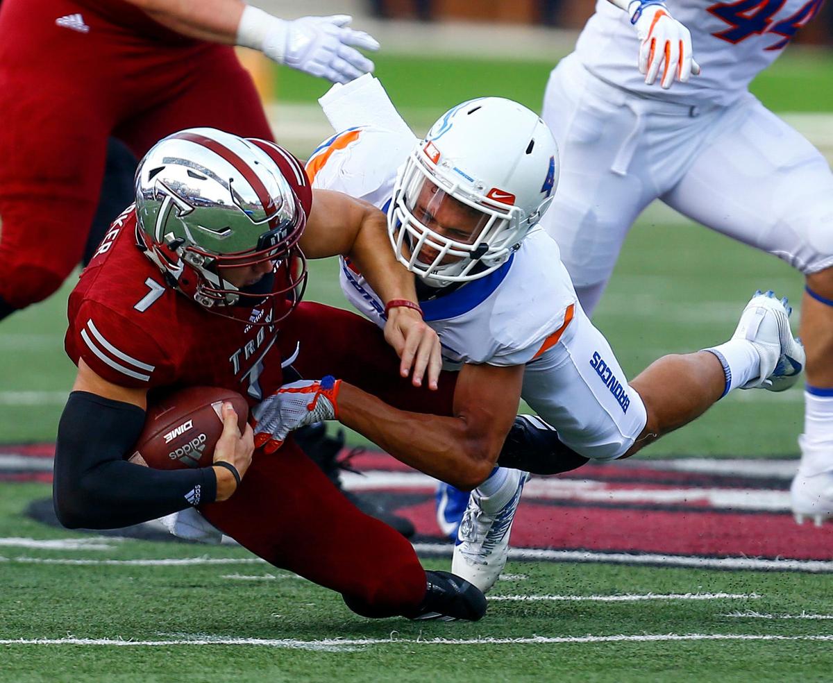 Troy quarterback Kaleb Barker (7) is tackled by Boise State safety DeAndre Pierce (4) during the first half of an NCAA college football game, Saturday, Sept. 1, 2018, in Troy, Ala. (AP Photo/Butch Dill)