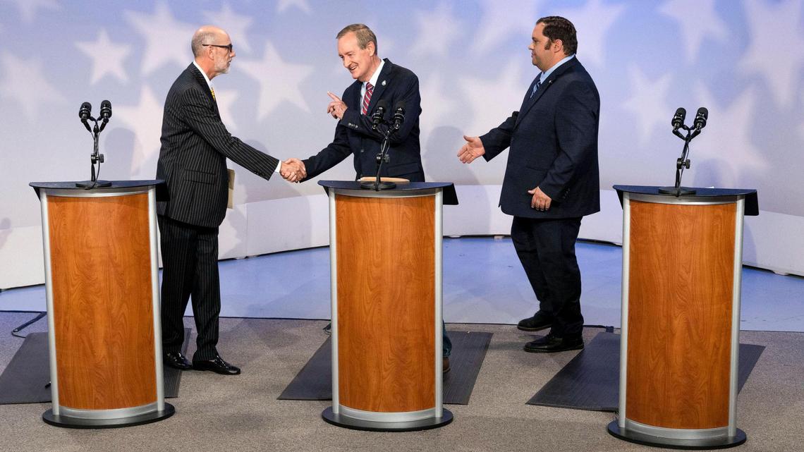 Incumbent U.S. Sen. Mike Crapo, R-Idaho, center, shakes the hands if opponents Scott Cleveland, an independent, left, and Democratic candidate David Roth following a debate at Idaho Public Television, on Monday, Oct. 3, 2022, in Boise.