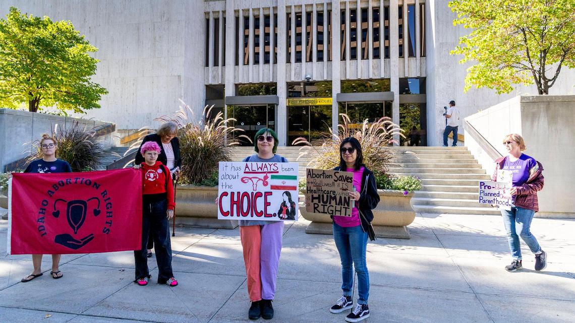 Protesters stand in front of the Idaho Supreme Court building last during oral arguments over challenges to abortion laws in this 2022 file photo.