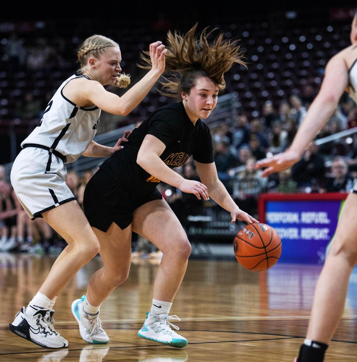 Bishop Kelly sophomore Brooke Hutchinson dribbles during the 4A girls basketball state semifinals against Shelley on Friday at the Ford Idaho Center in Nampa.