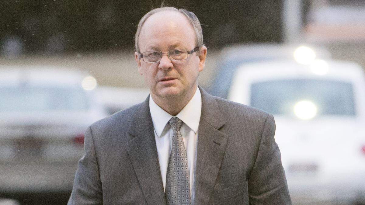 Douglas L. Swenson, DBSI's president, makes his way into federal court in Boise during the 2014 federal trial of four top executives of the failed property investment giant DBSI.