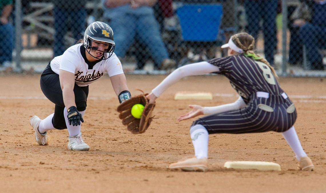 Bishop Kelly junior Harper Campanella is out as Vallivue senior Brooke Garman makes the catch at second base in the fifth inning of the 4A District Three Tournament championship game at West Park in Nampa on Thursday.