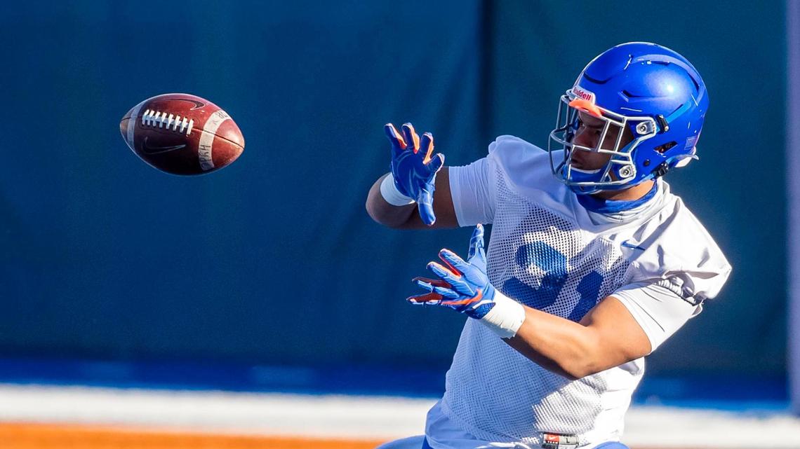 Boise State running back Andrew Van Buren catches a pass during drills Friday, March 12, 2021 on the blue turf of Albertsons Stadium in Boise. The Broncos have begun their spring football camp.