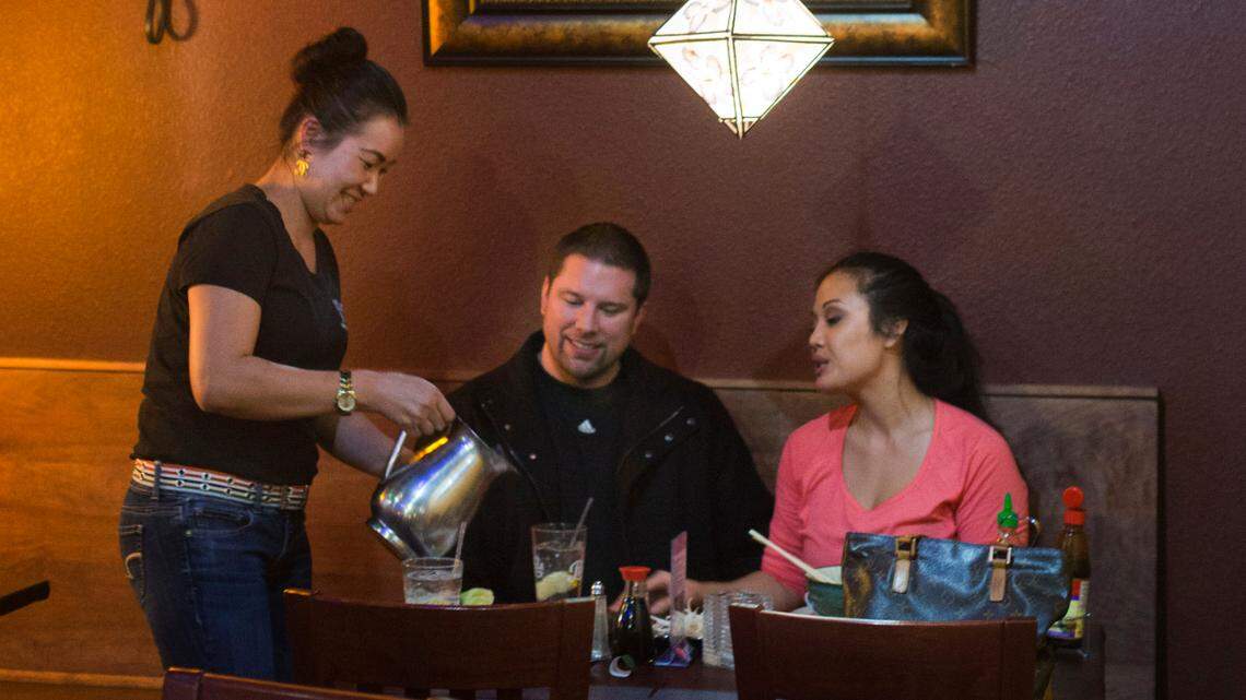 In this 2014 file photo, a couple dines at Thai Basil in Meridian, which remains open at the corner of Fairview Avenue and Eagle Road.