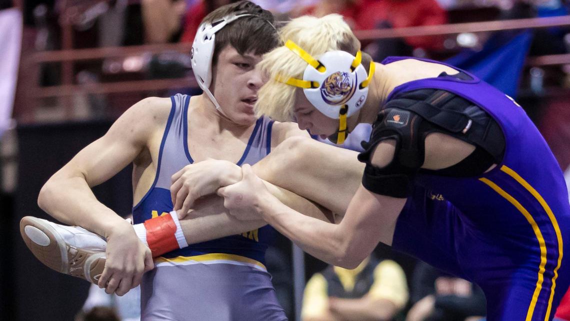 Meridian’s Jason Mara gets a leg up on Lewiston’s Tristan Bremer in the 126-pound state 5A wrestling championship match Feb. 26 at the Ford Idaho Center in Nampa.