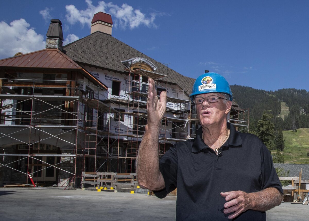 Tamarack Resort’s John Reveal, president of a group of owners, shares his enthusiasm as construction moves forward on a portion of the unfinished condominiums at resort’s centerpiece Village Plaza.