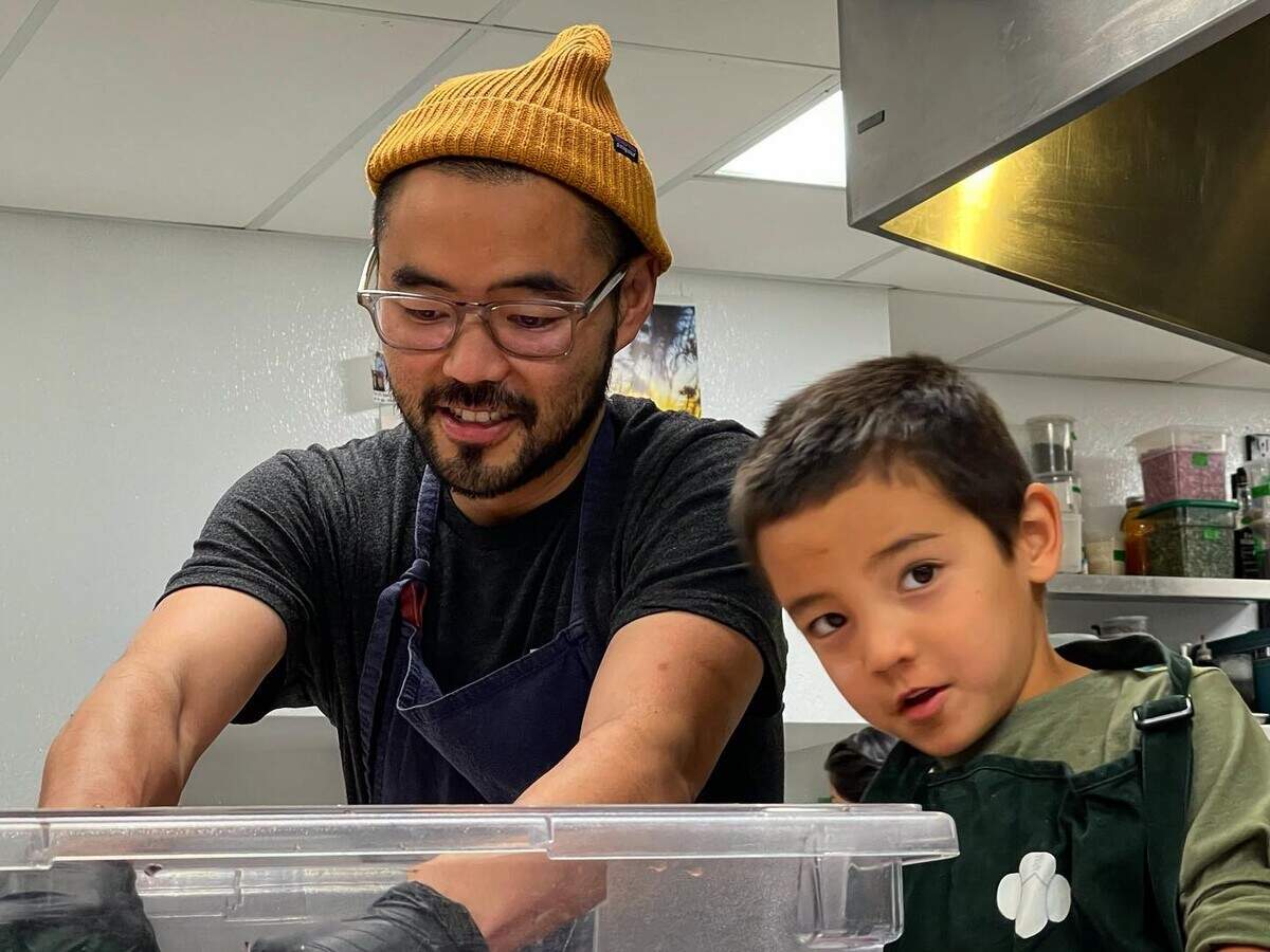 Kris Komori of Kin at work in the kitchen with his son, Kichi.