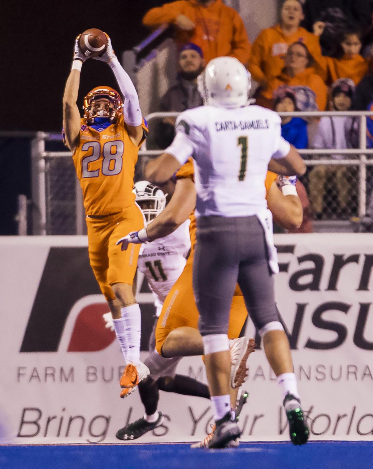 Boise State safety Kekaula Kaniho (28) intercepts a pass by Colorado State quarterback K.J. Carta-Samuels (1), thwarting a Rams’ drive at the goal line Friday, Oct. 19, 2018 at Albertsons Stadium in Boise.