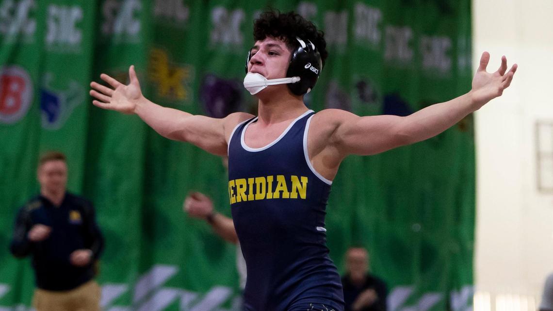 Meridian’s Jerimiah Gonzalez celebrates winning the 113-pound title at the 5A District Three wrestling tournament with a 5-2 decision over Nampa’s Aulani Macias on Wednesday at Expo Idaho in Garden City.