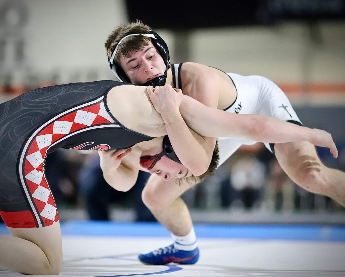 Bishop Kelly 132-pounder Jake Castagneto fights off a shot attempt from Shelley’s Carter Balmforth on Saturday en route to a state championship win at the ICCU Dome in Pocatello.
