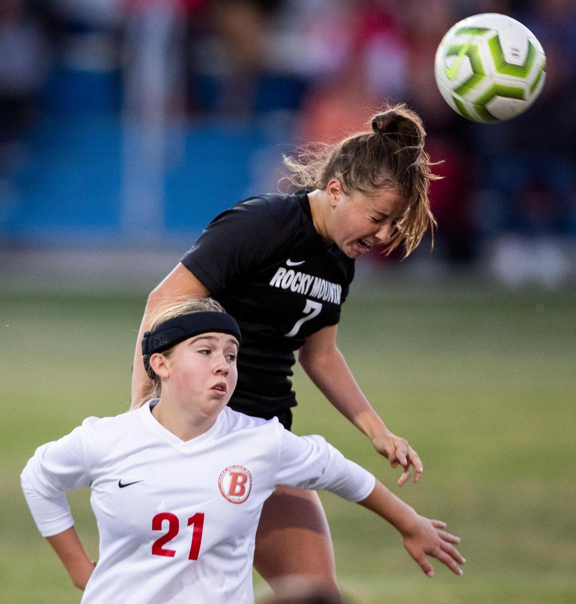 Rocky Mountain defender Carli Messmer leaps over Boise’s Mia Barron in the 5A Distrct Three championship game last fall.