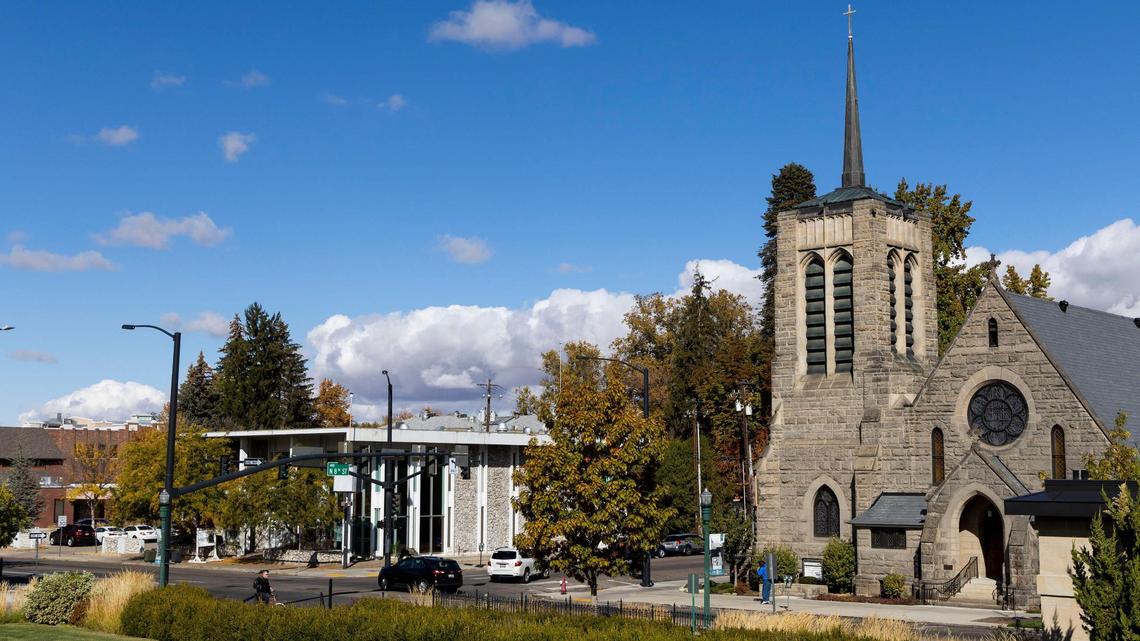 St. Michael’s Cathedral, right, was completed in 1902 and sits across the street from the former Home Federal bank building, left. Hummel Architects descended from the original company that designed St. Michael’s.