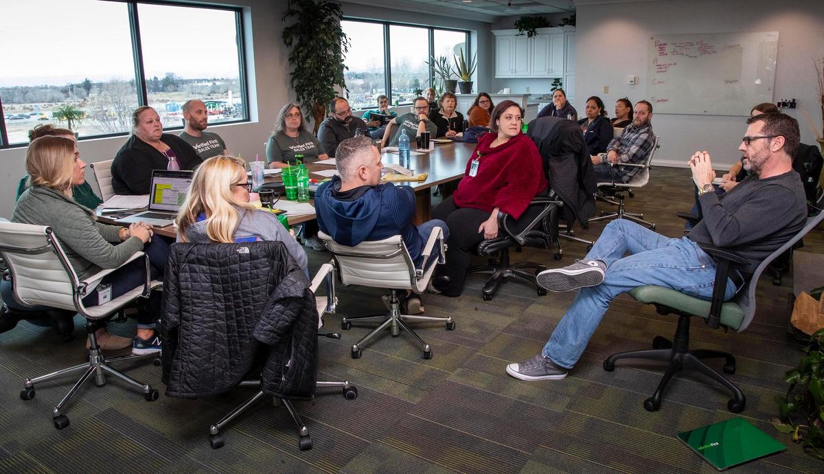 Employees at Verified First, meet for training at the company’s offices at 1550 S. Tech Lane in Meridian. The background checking firm is growing and plans to expand into a new space.