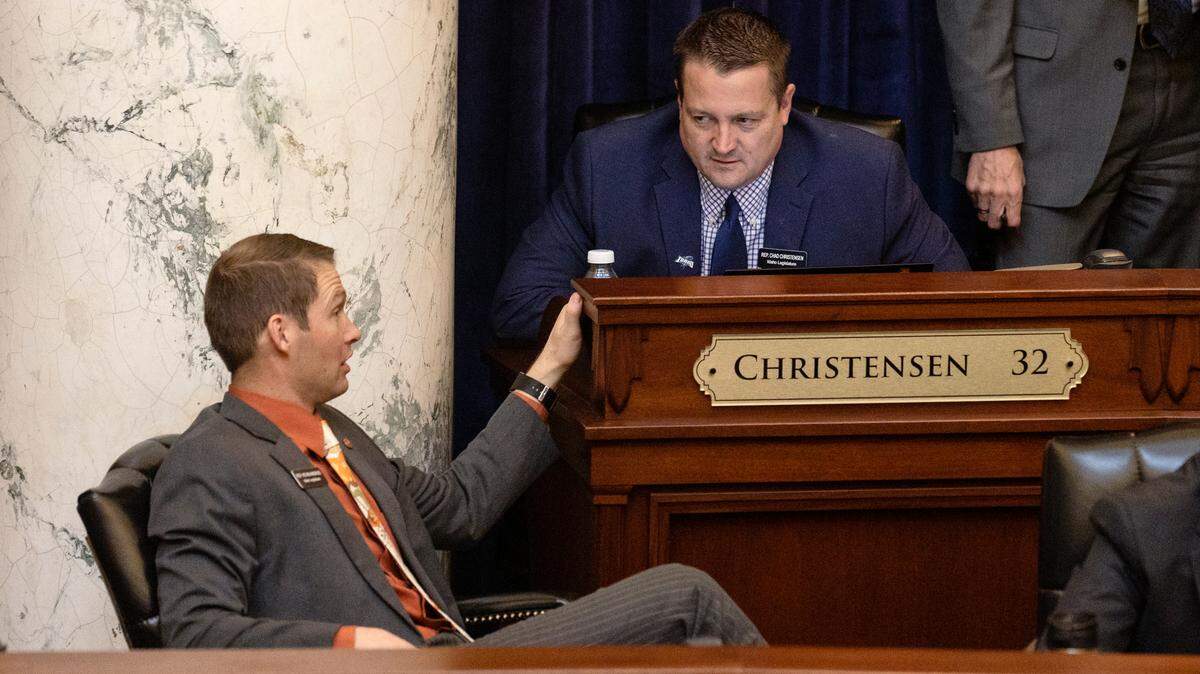 Rep. Kevin Andrus, R-Lava Hot Springs, and Rep. Chad Christensen, R-Iona, talk before the start of the House session on March 16. Christensen is being sued for blocking Idaho residents on social media.