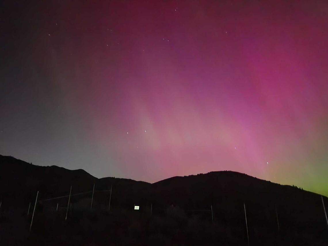 The northern lights pay a rare visit to Lucky Peak in Boise, Idaho, early in the morning on Saturday, May 11, 2024.