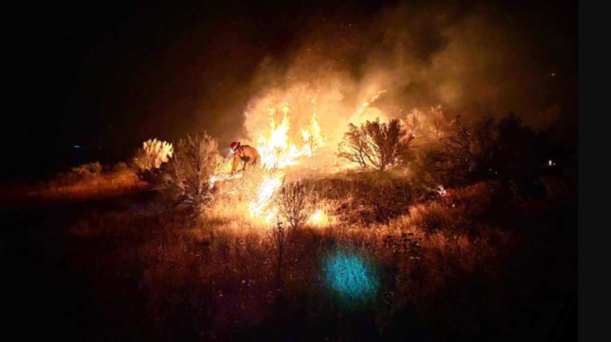 Fire crews work to contain the Hartley fire near Eagle. A 16-year-old Meridian teen was arrested and charged with arson in connection to the fire. 