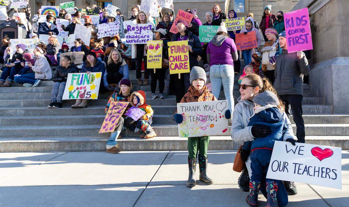 Child care workers, parents and children gathered at the Idaho Capitol Building in 2023 to oppose a proposed cut to provider funding.