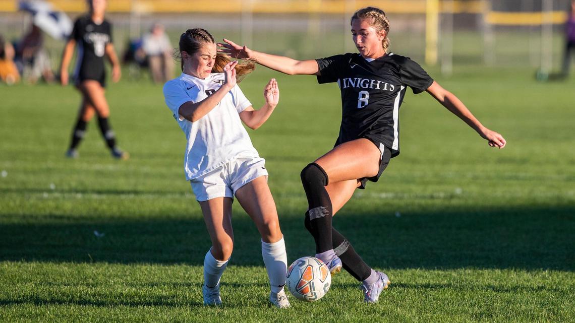 Bishop Kelly junior Sophie Schmautz controls the ball while pressured by Vallivue’s Macey Blaisdell on Thursday.