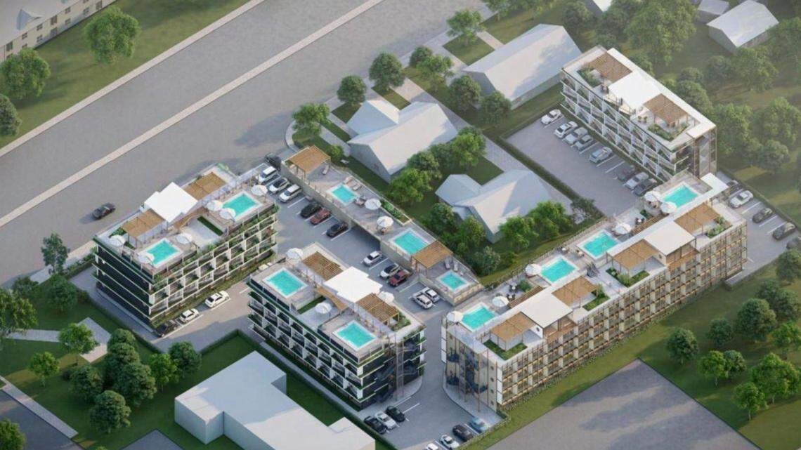 his southeast-facing aerial rendering shows the buildings with several rooftop swimming pools. Jefferson Elementary can be seen at top left corner and the Latah Village Apartments at bottom, left of center.