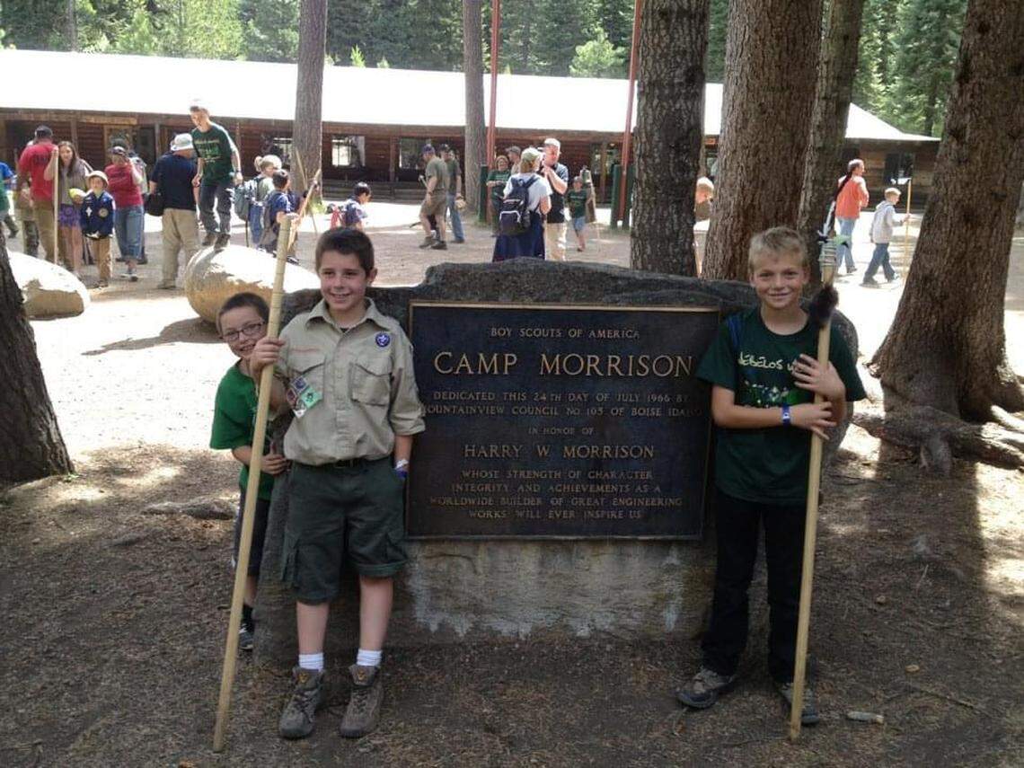 The author’s son Luke, left, and his fellow Scout Steven Shults pose for a photo in June 2012 at the sign dedicating Camp Morrison in honor of Harry Morrison.
