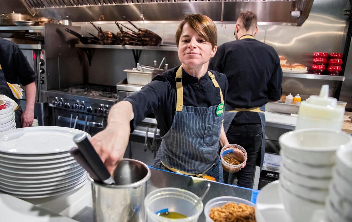 Sarah Kelly plates dinner for patrons at Petite 4 earlier this year.
