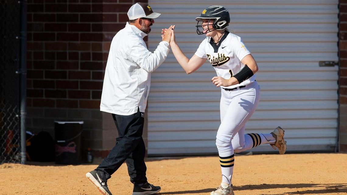 Bishop Kelly junior Faith Nichols high-fives her coach as she runs past third base after hitting a home run in the fourth inning of their 7-0 win against Vallivue on Tuesday at Bishop Kelly High.