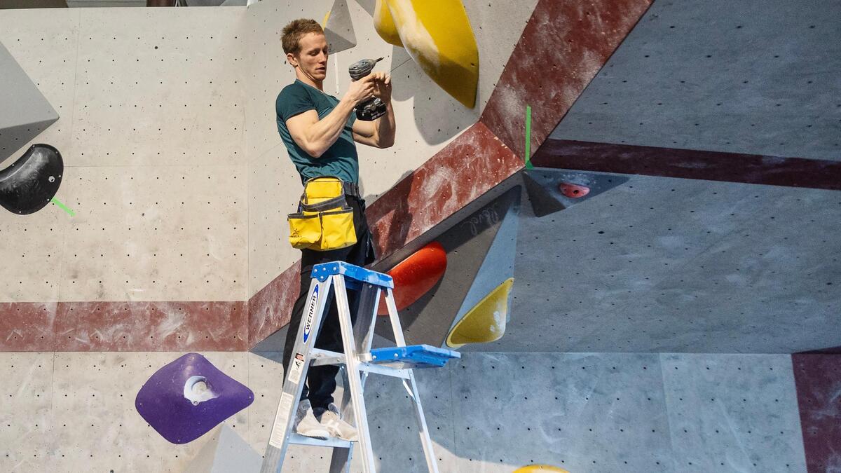 Brannon Frank, head route setter at Asana Climbing Gym, works on a wall on Dec. 9, 2022. Asana is hosting the Idaho Bouldering Championship on Dec. 17