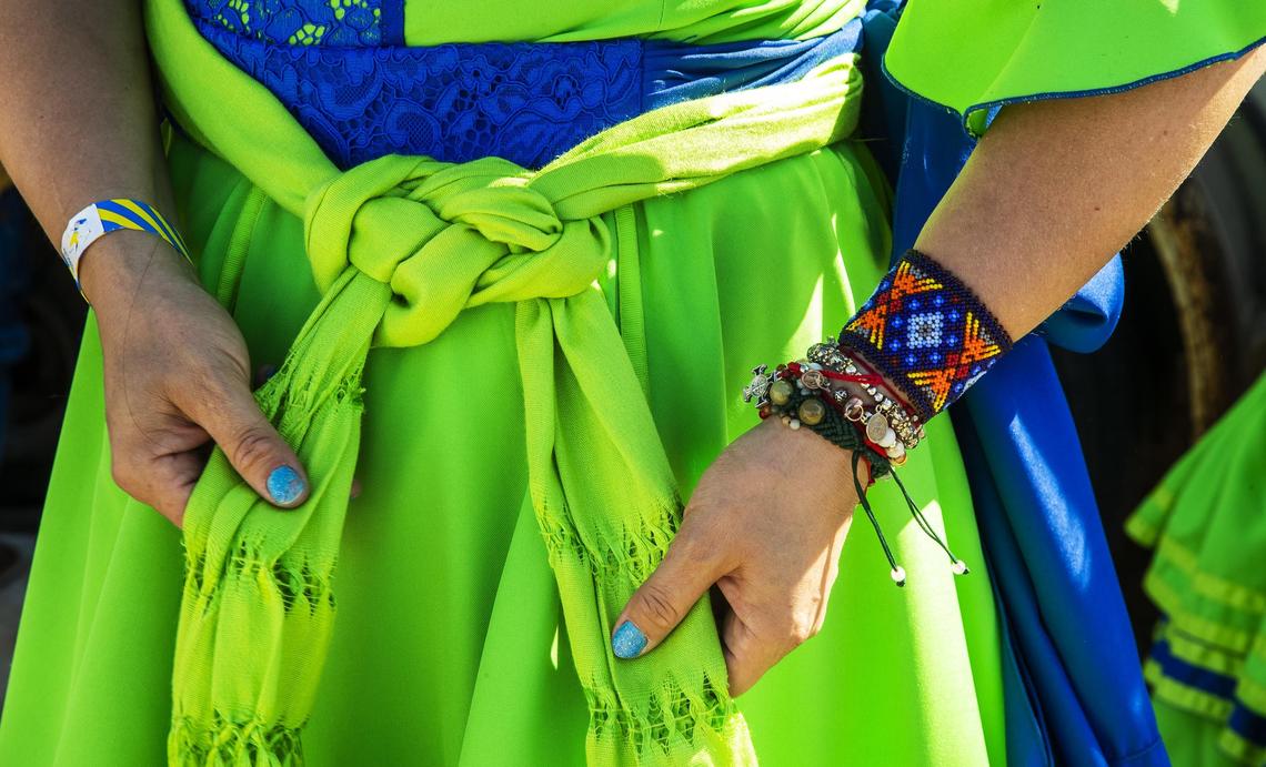 Paloma Sanchez displays the sash knot of one of her “La Adelita” dresses.