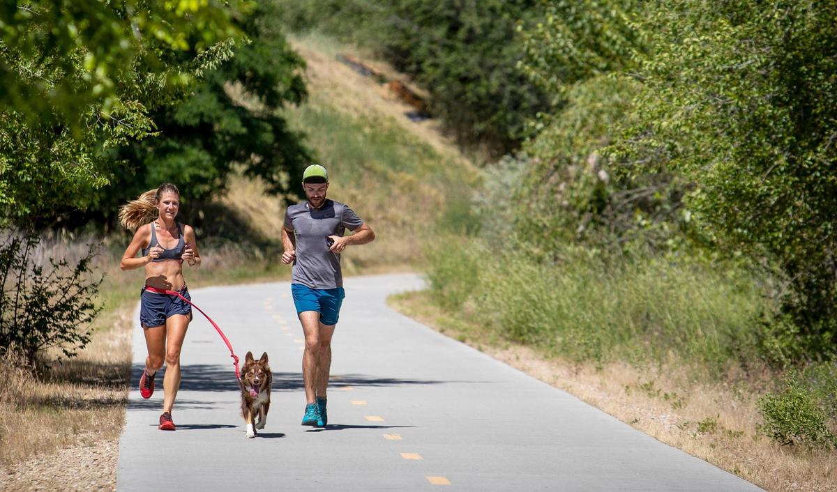 Alex Borsuk and Matt Hasenohr, of Portland, Oregon, enjoy a run along the Boise Greenbelt Thursday, July 2, 2020. The two said they were passing through Boise and decided to stop for a run and were delighted to learn about the Greenbelt.