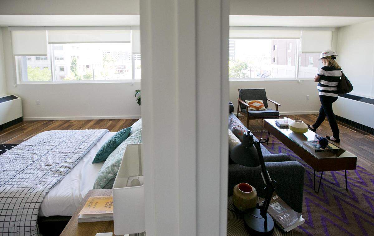 Dianne Dillingham tours one of the 32 new 700 square-foot, one-bedroom apartments available for residential living.
