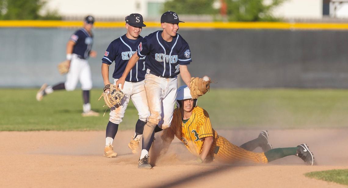 Skyview’s Ledger Downs records an out at second base while Bonneville’s Taye Lords looks on Thursday.
