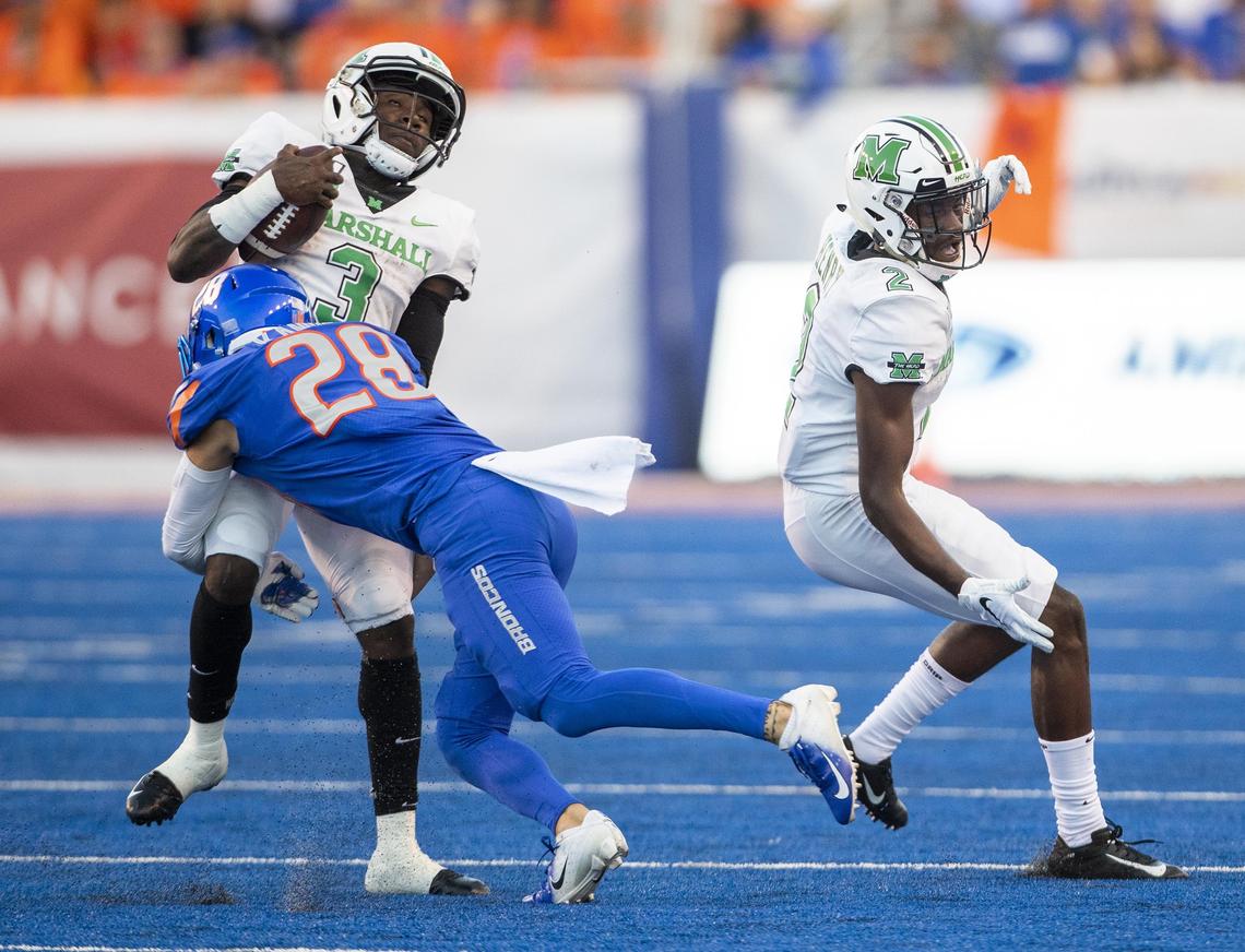 Boise State nickelback Kekaula Kaniho (28) tackles Marshall running back Tyler King (3) in the home opener at Albertsons Stadium Friday, Sept. 6, 2019 in Boise.
