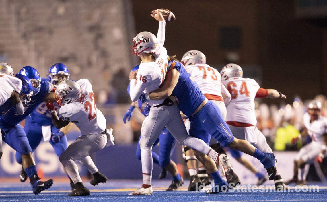 Boise State defensive end Shane Irwin hits New Mexico quarterback Connor Genal causing a fumble which was recovered by Boise State during the first half of the game at Albertsons Stadium. Boise State leads New Mexico 24-0 at the half Saturday November, 20, 2021.