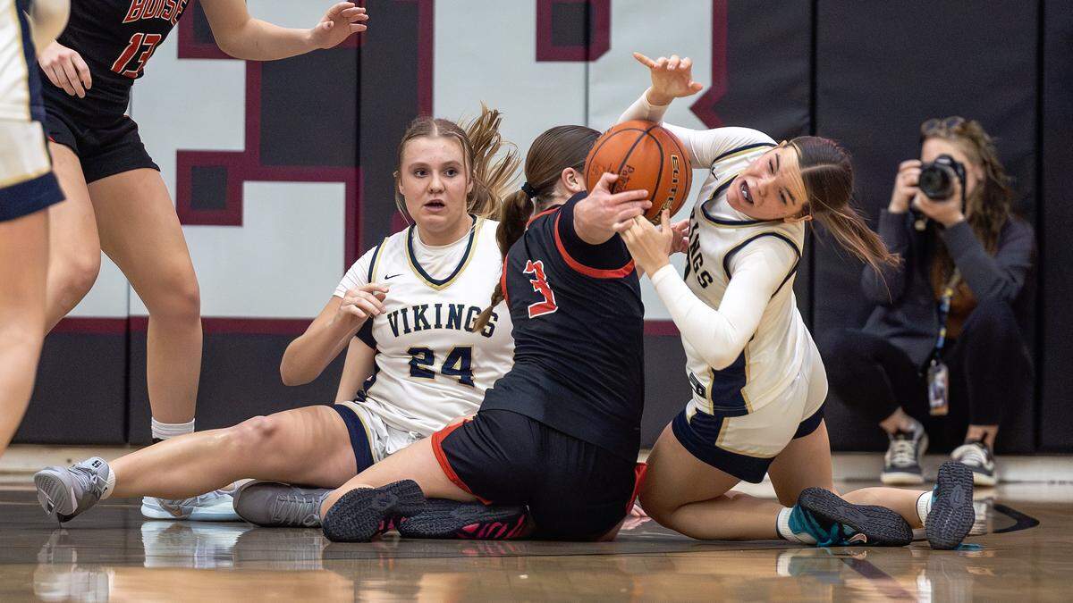 Boise junior Ashlyn Waldram and Middleton junior Olivia Blackwell fight for control of the ball during the semifinals of the 6A District Three girls basketball tournament held at Centennial High School, Saturday, Feb. 7, 2026. Boise won 59-51.