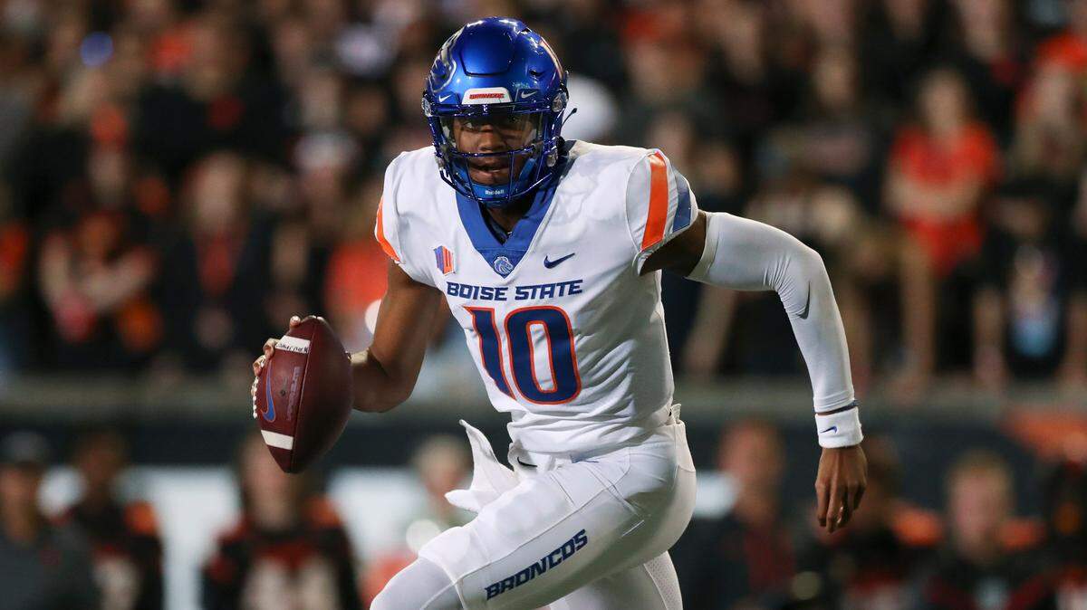 Boise State quarterback Taylen Green keeps his eyes downfield while evading pass rushers in the Broncos’ season opener at Oregon State on Saturday.
