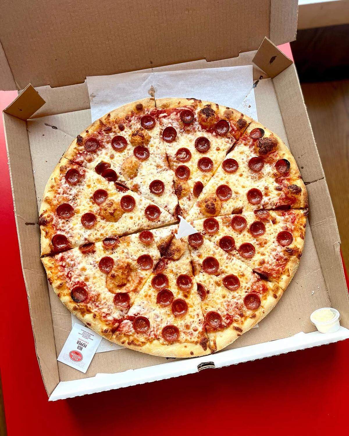 Americana Pizza serves New York-style thin crust pies.