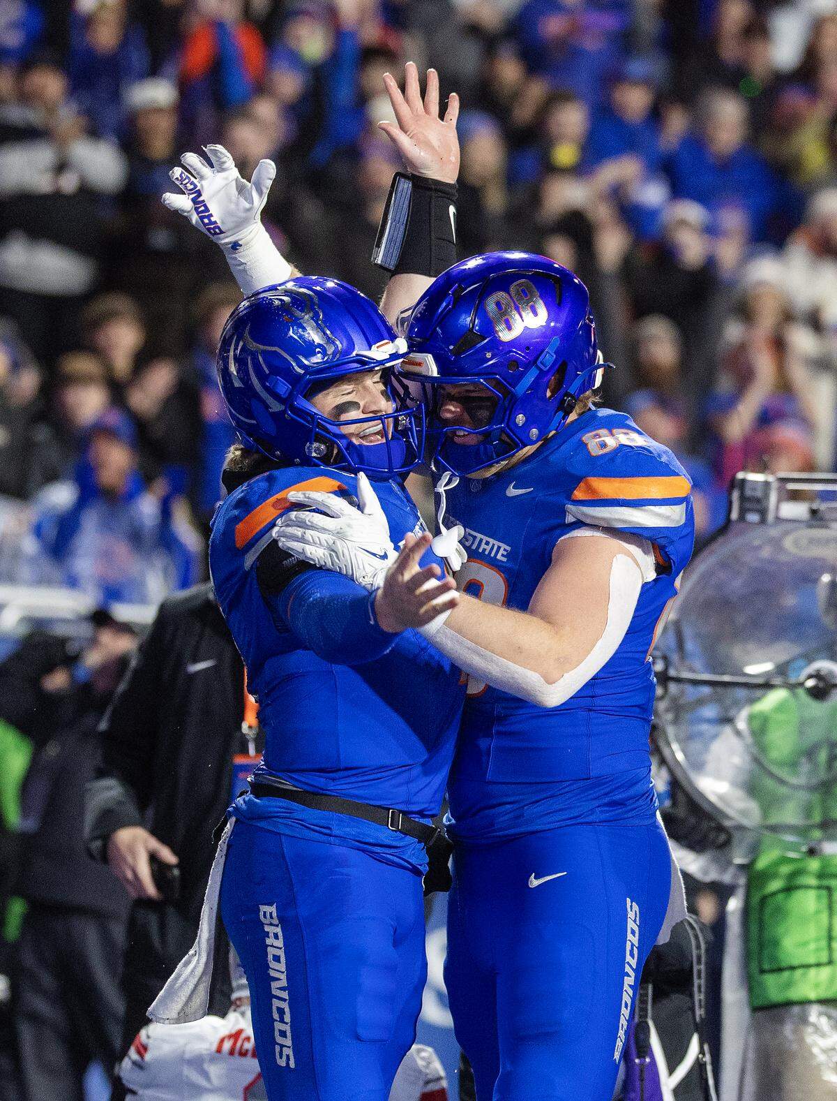 Boise State quarterback Maddux Madsen, left, celebrates with tight end Matt Wagner in the first quarter after Madsen ran for a touchdown.