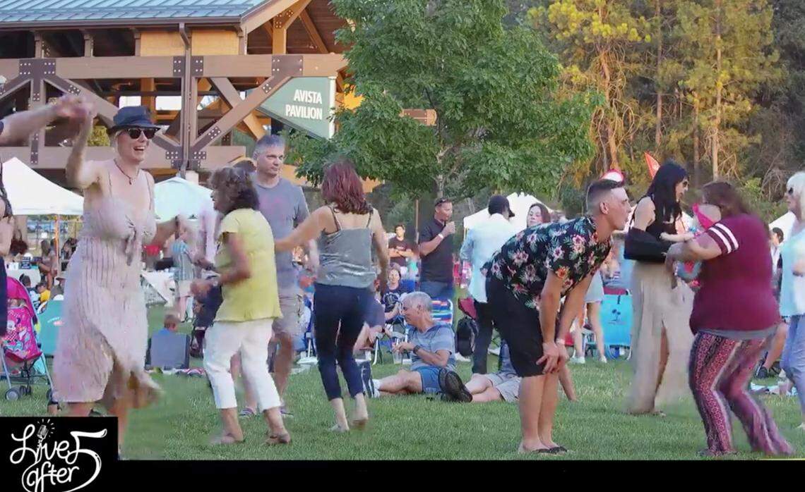 Mostly maskless people dance at a Live After 5 concert on Aug. 19 in Coeur d’Alene. One day later, the Panhandle Health District ordered the wearing of masks in indoor and outdoor public places where a social distance of 6 feet could not be maintained.