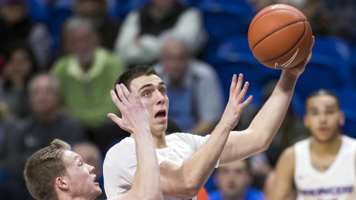Boise State guard Justinian Jessup drives by Idaho State’s Jared Stutzman on Nov. 10 at Taco Bell Arena in Boise. The Broncos are looking for their first win of the season against Jackson State on Friday.