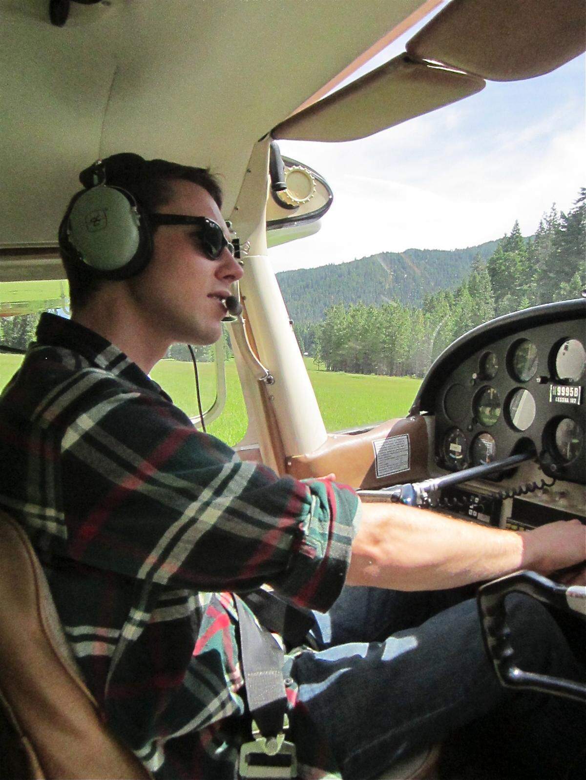 Richard Holm, author of “In Selway Shadows: Last Flight of 148Z” in the cockpit of an airplane.