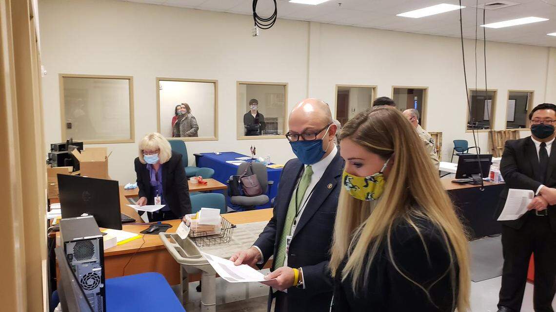 Alexis Pickering, front, looks at election results with Ada County Clerk Phil McGrane.