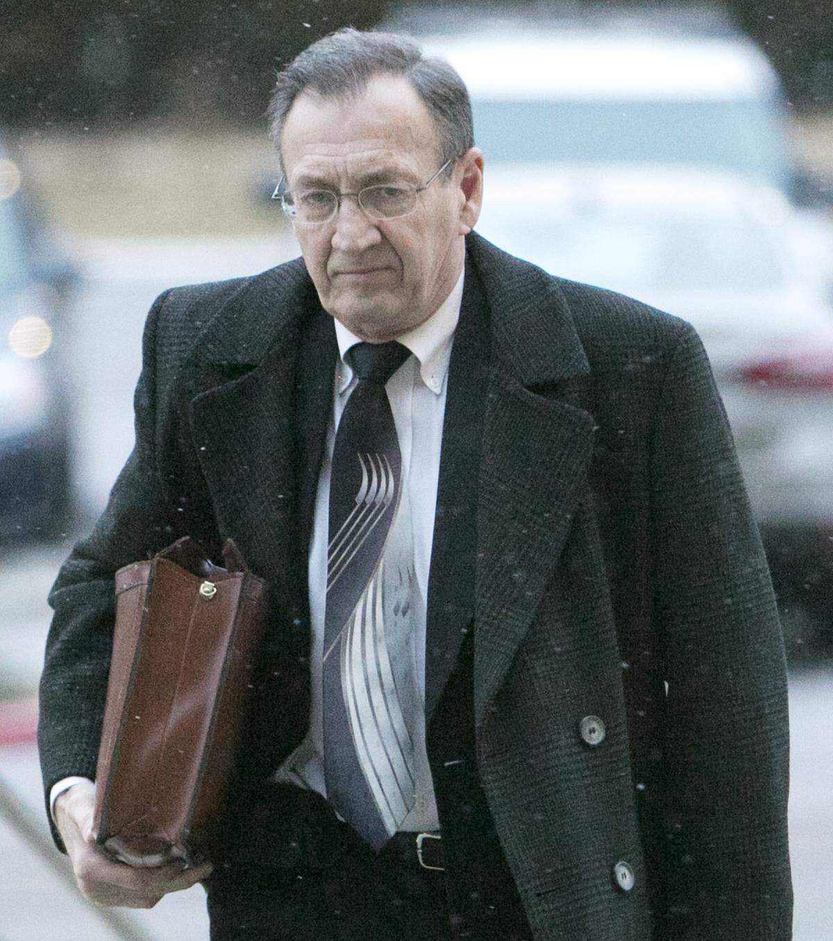 Mark A. Ellison, a DBSI co-founder and later the company attorney, makes his way into Federal Court in Boise during the 2014 federal trial of four top executives of the failed property investment giant DBSI.